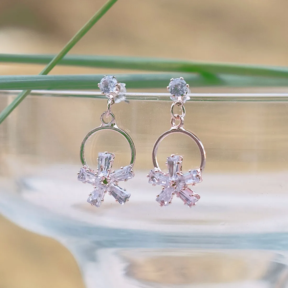 CONTEMPORARY RHINESTONE STUDDED ROSE-GOLD TONED FLOWER DROP EARRINGS