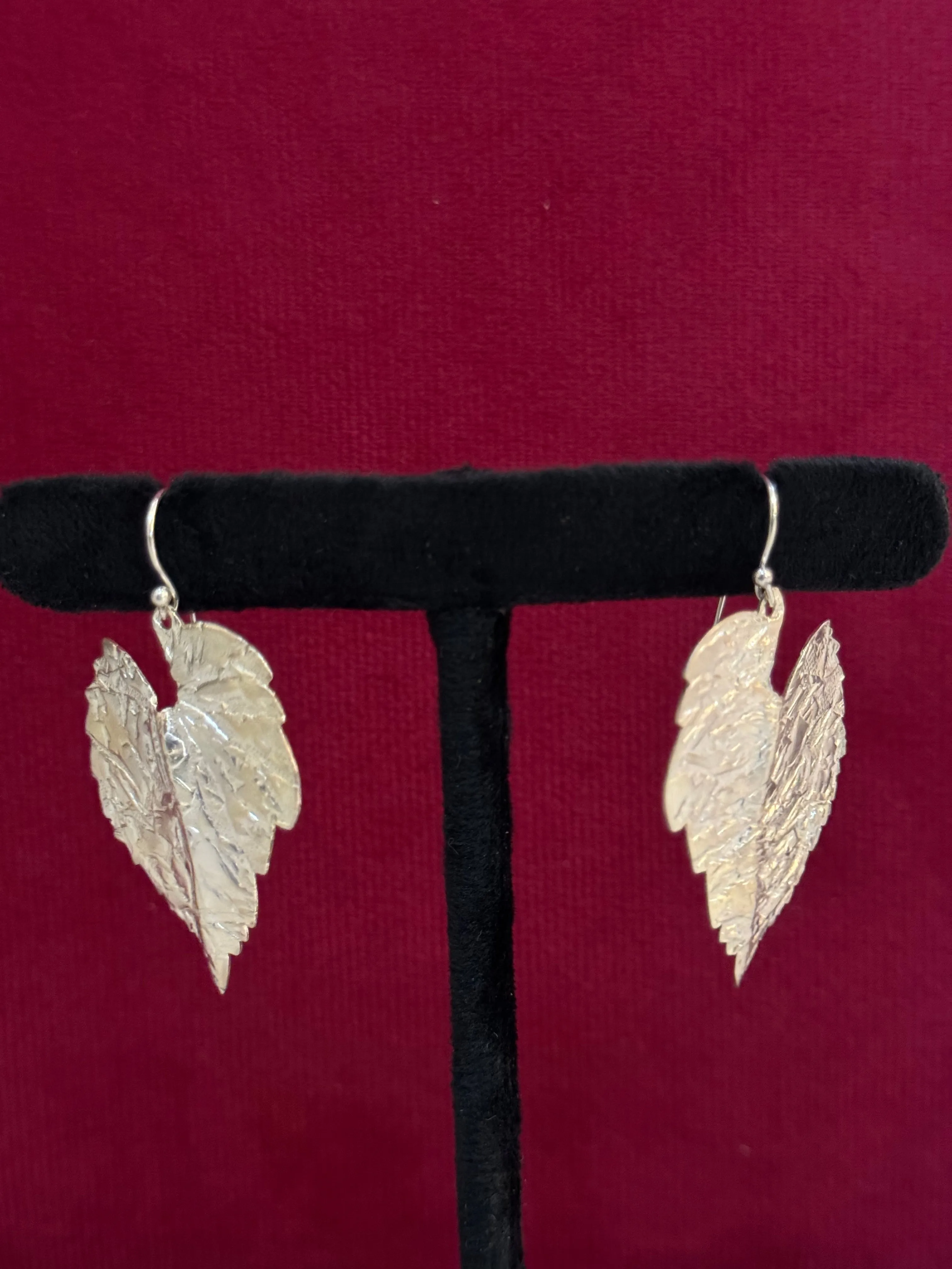 Embossed silver leaf shaped hooks earrings in 92.5 sterling silver