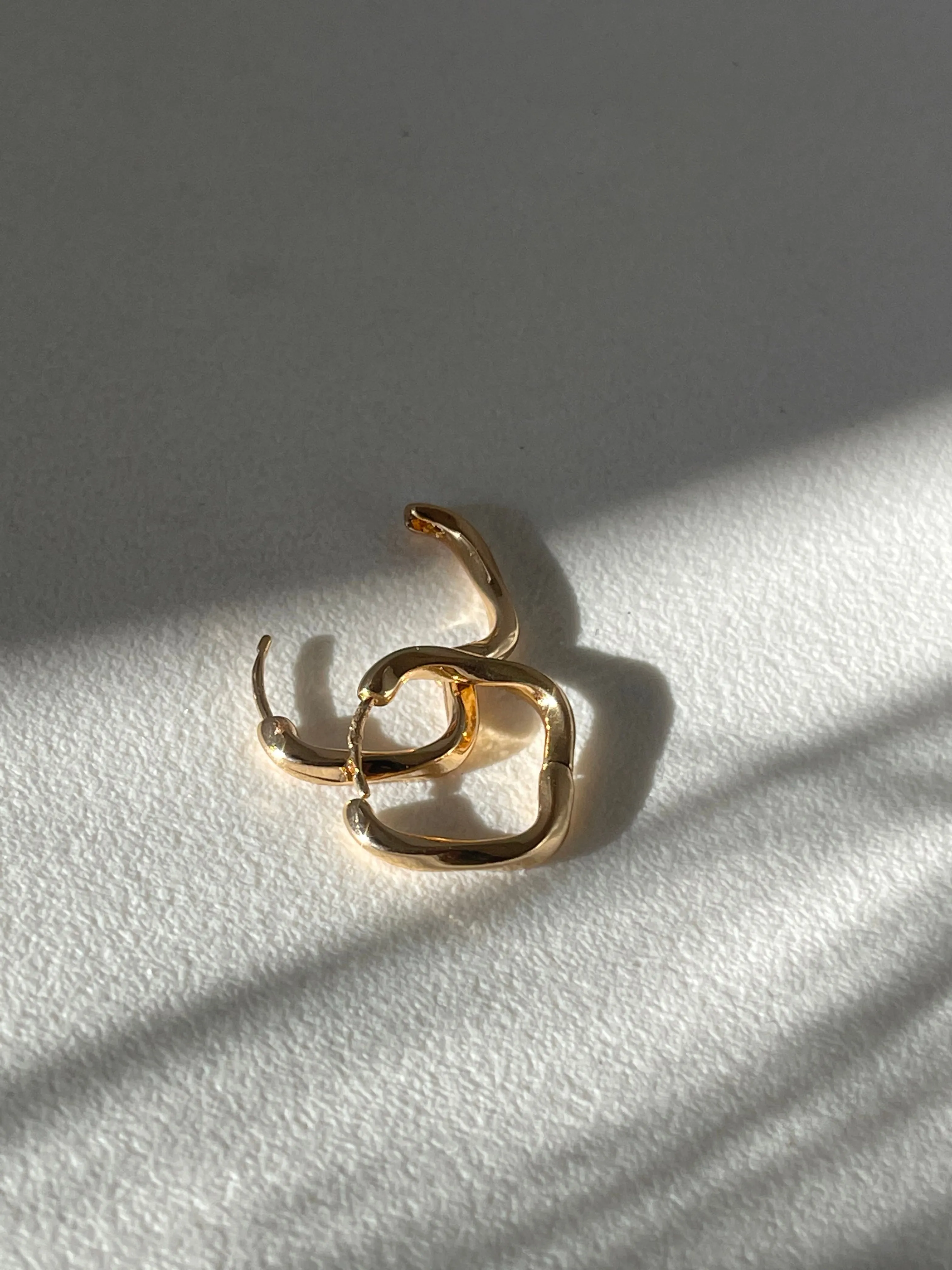 Kirsten Twist Stainless Steel Hug Hoop Earring In Gold